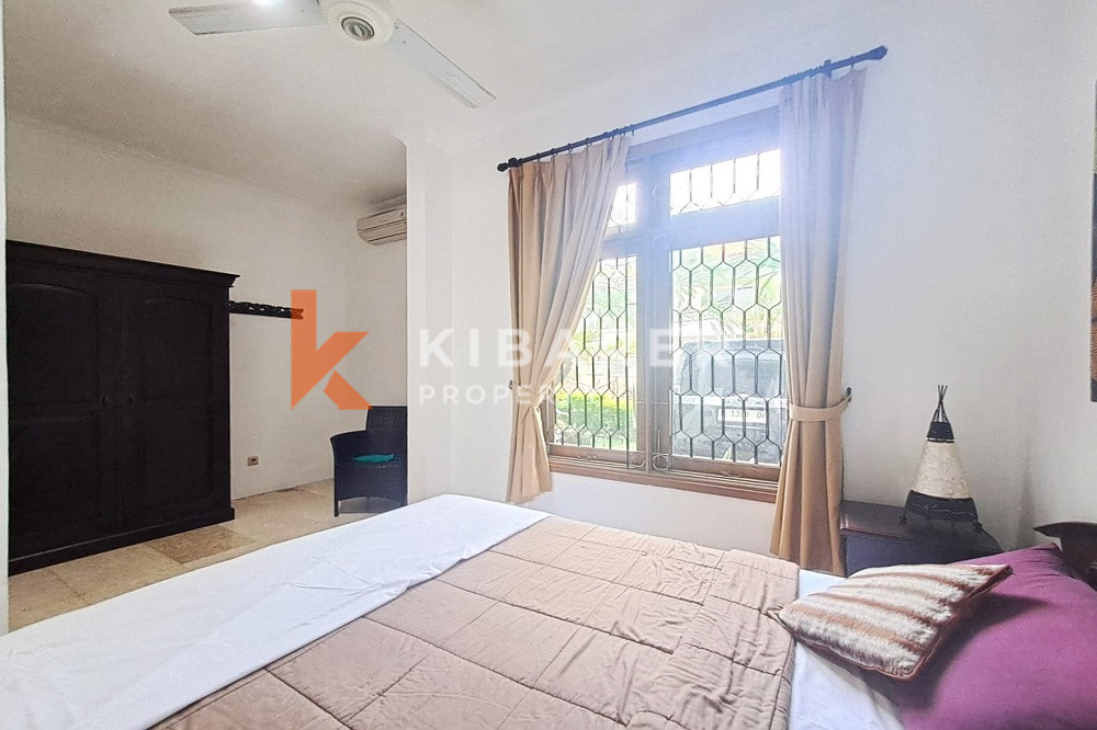 Homey Four Bedroom Classic Enclosed Living Room Villa in Kuta