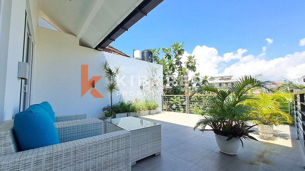 Picturesque Three Storey Three-Bedroom Villa Enclosed Living Room with Rooftop Located in Kerobokan Area